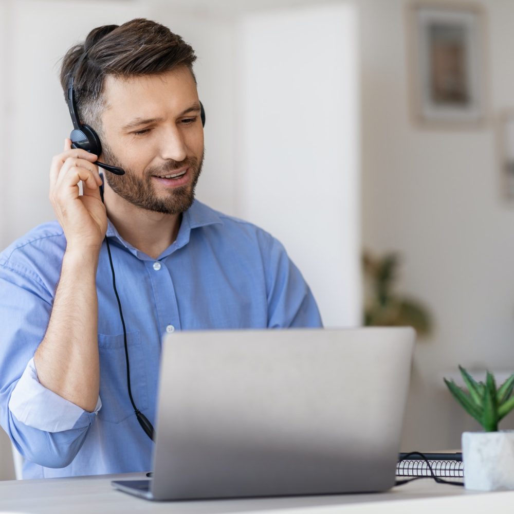 hotline-operator-portrait-of-call-center-employee-wearing-headset-at-workplace-in-office-1